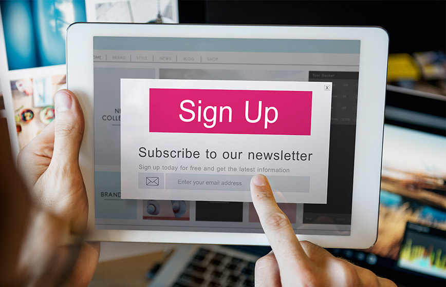 a user signing up for a newsletter subscription and increasing the websites conversion rate.