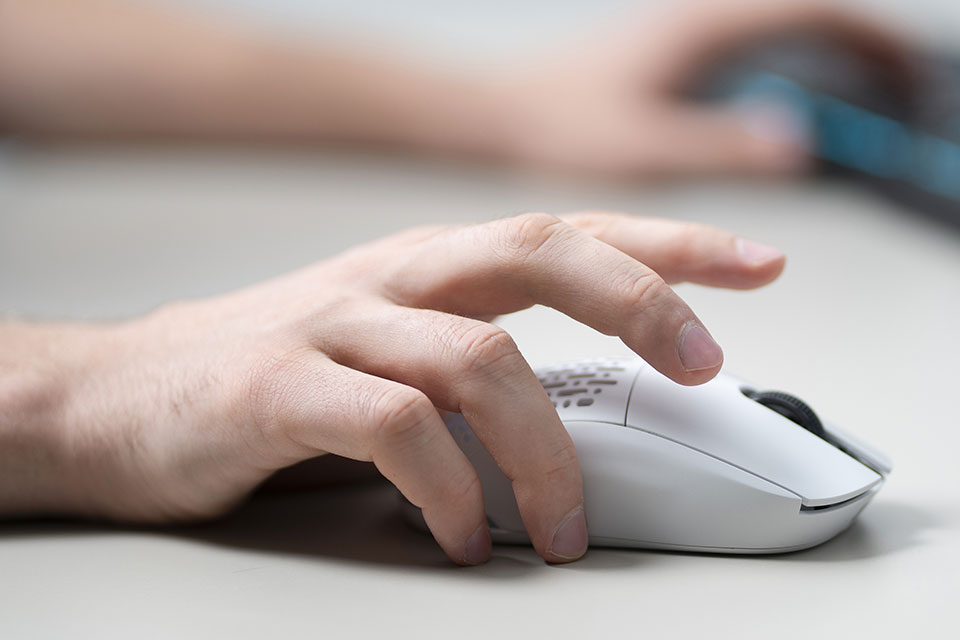 person clicking computer mouse